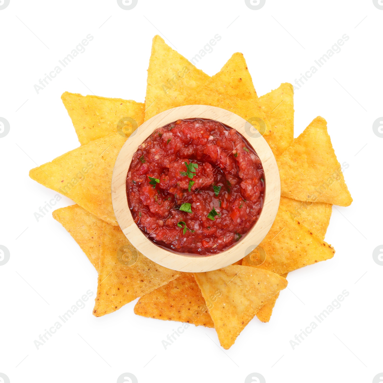 Photo of Spicy salsa sauce in bowl and nachos isolated on white, top view