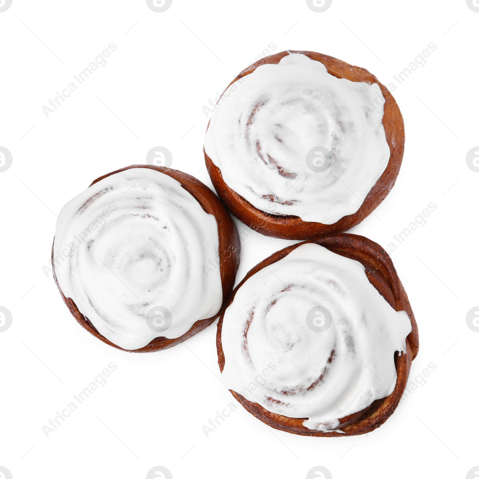 Photo of Tasty cinnamon rolls with cream isolated on white, top view