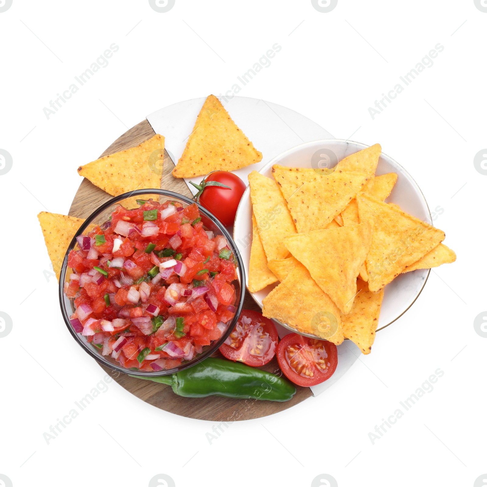 Photo of Delicious salsa in bowl, nacho chips and ingredients isolated on white, top view