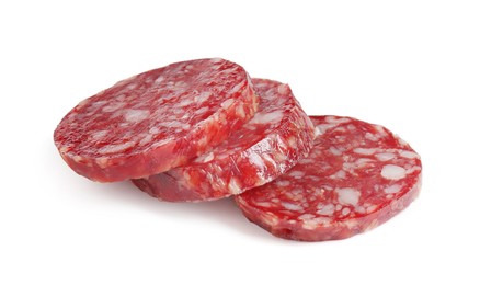 Photo of Pieces of delicious dry cured sausage isolated on white