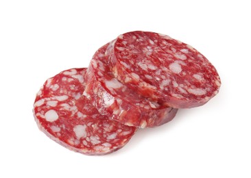 Photo of Pieces of delicious dry cured sausage isolated on white