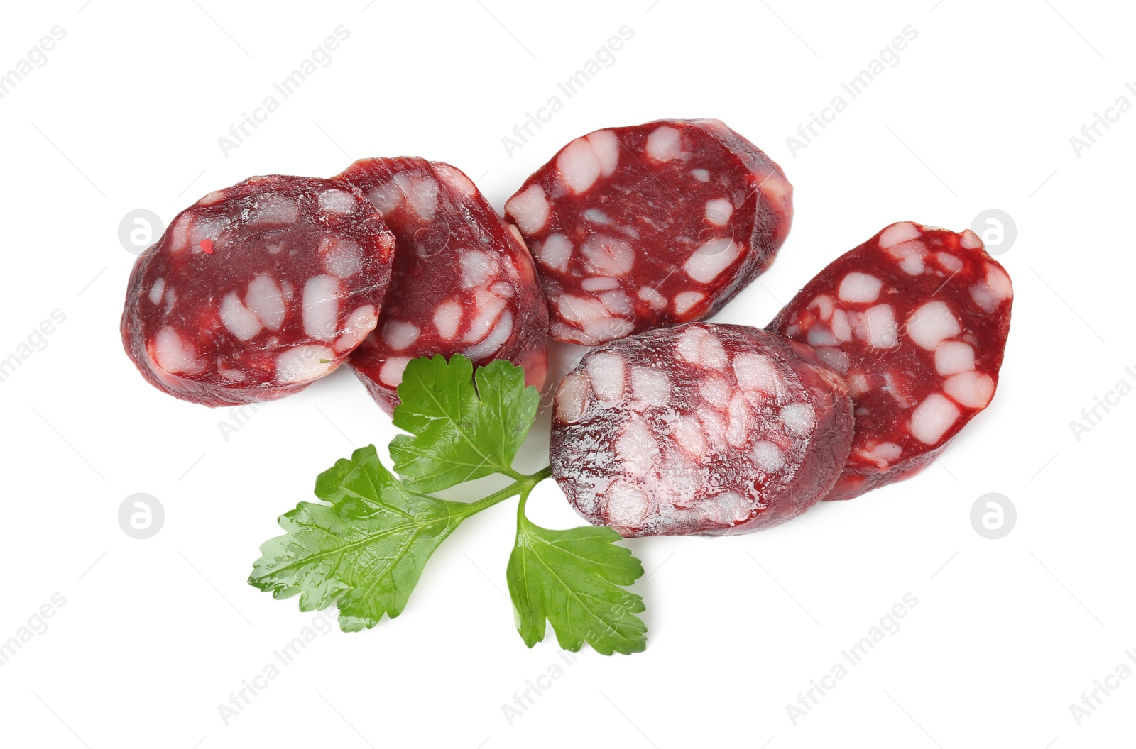 Photo of Pieces of delicious dry cured sausage and parsley isolated on white, top view