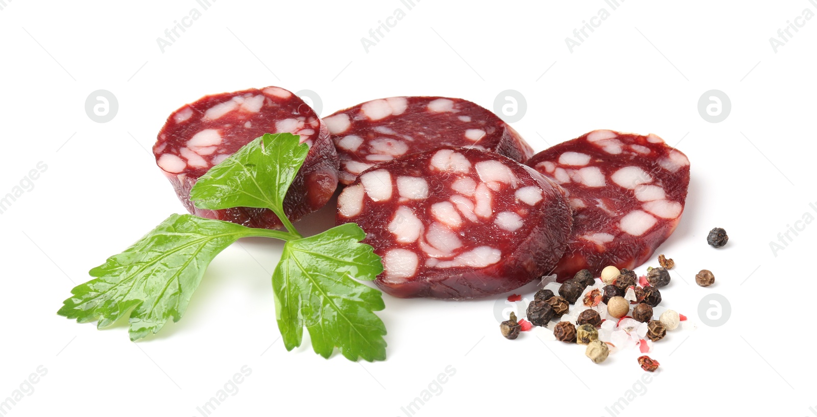 Photo of Pieces of delicious dry cured sausage and spices isolated on white