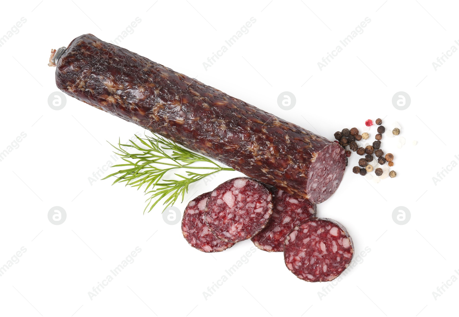 Photo of Delicious dry cured sausage and spices isolated on white, top view