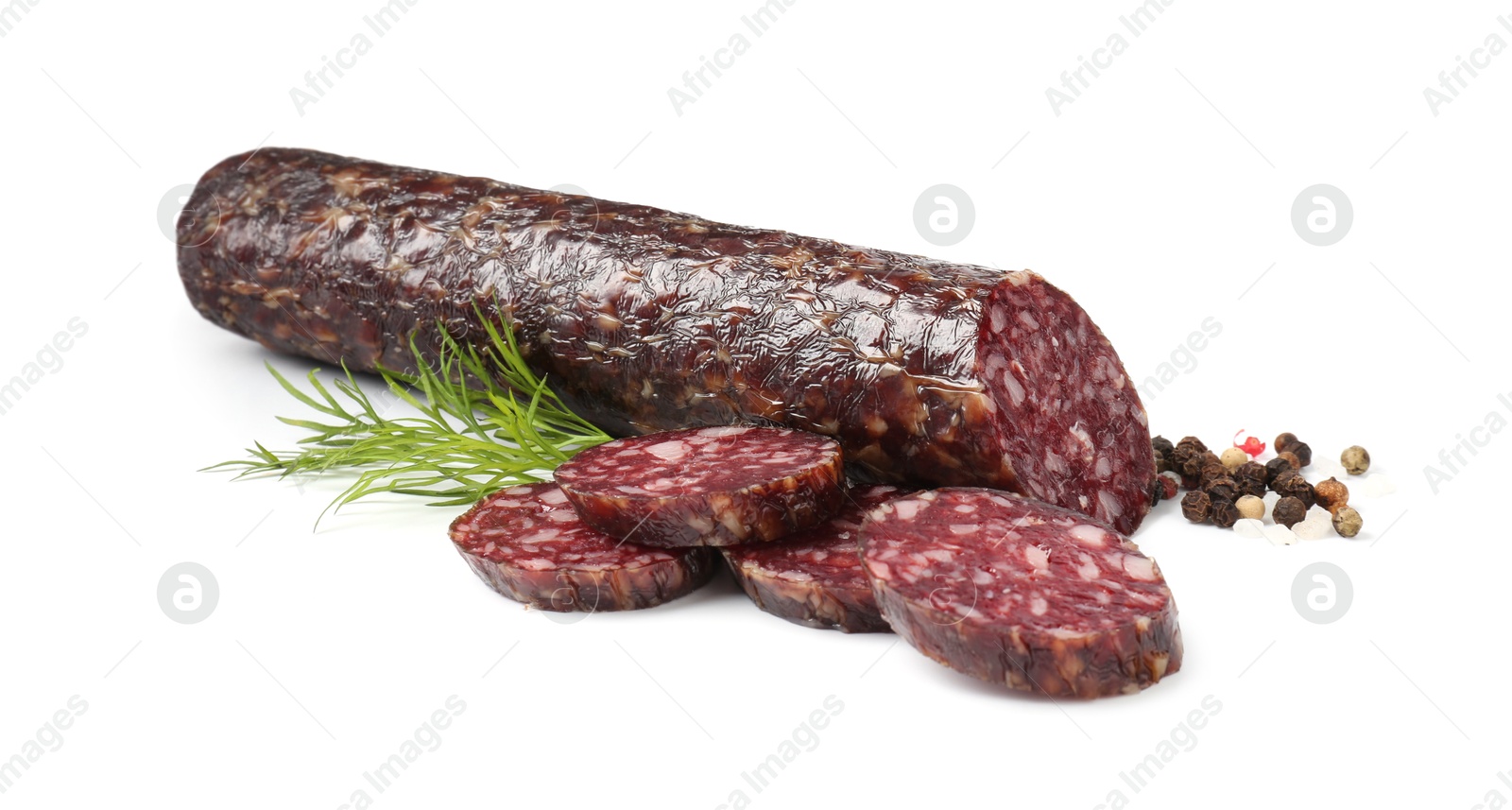 Photo of Delicious dry cured sausage and spices isolated on white