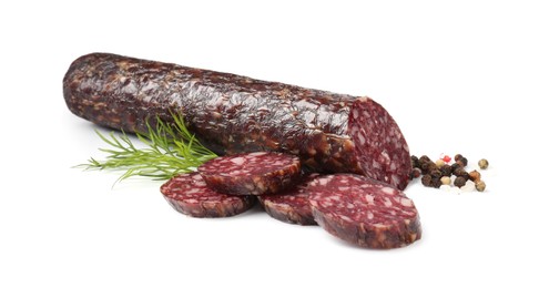 Photo of Delicious dry cured sausage and spices isolated on white