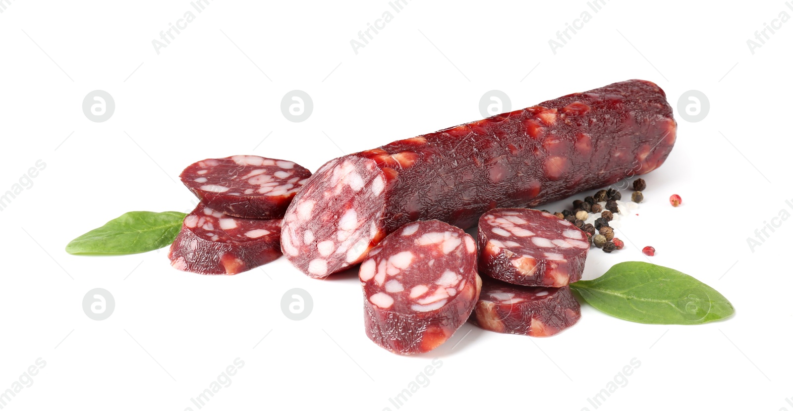 Photo of Delicious dry cured sausage and spices isolated on white