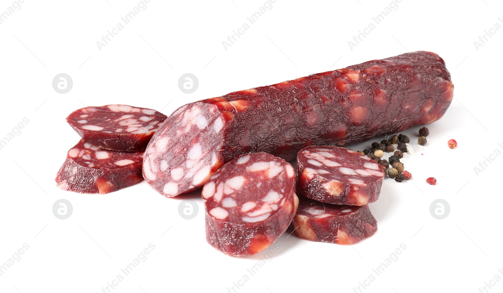 Photo of Delicious dry cured sausage and spices isolated on white