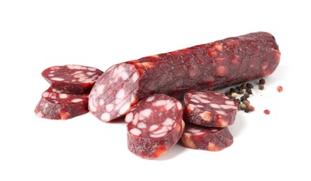 Photo of Delicious dry cured sausage and spices isolated on white