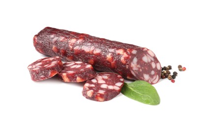 Photo of Delicious dry cured sausage and spices isolated on white