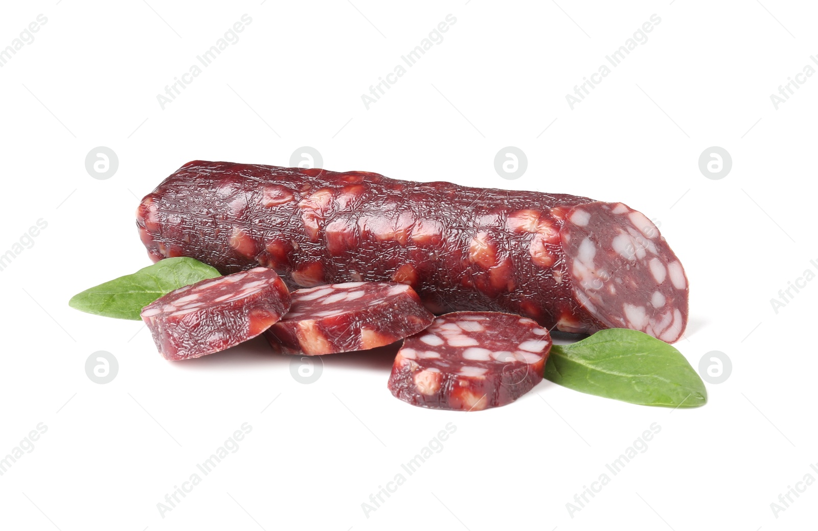 Photo of Delicious dry cured sausage and spinach isolated on white