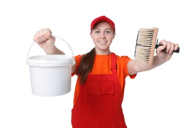 Professional painter with brush and bucket of paint on white background