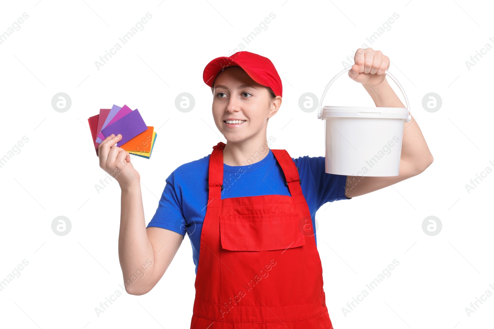 Photo of Professional painter with color samples and bucket of paint on white background