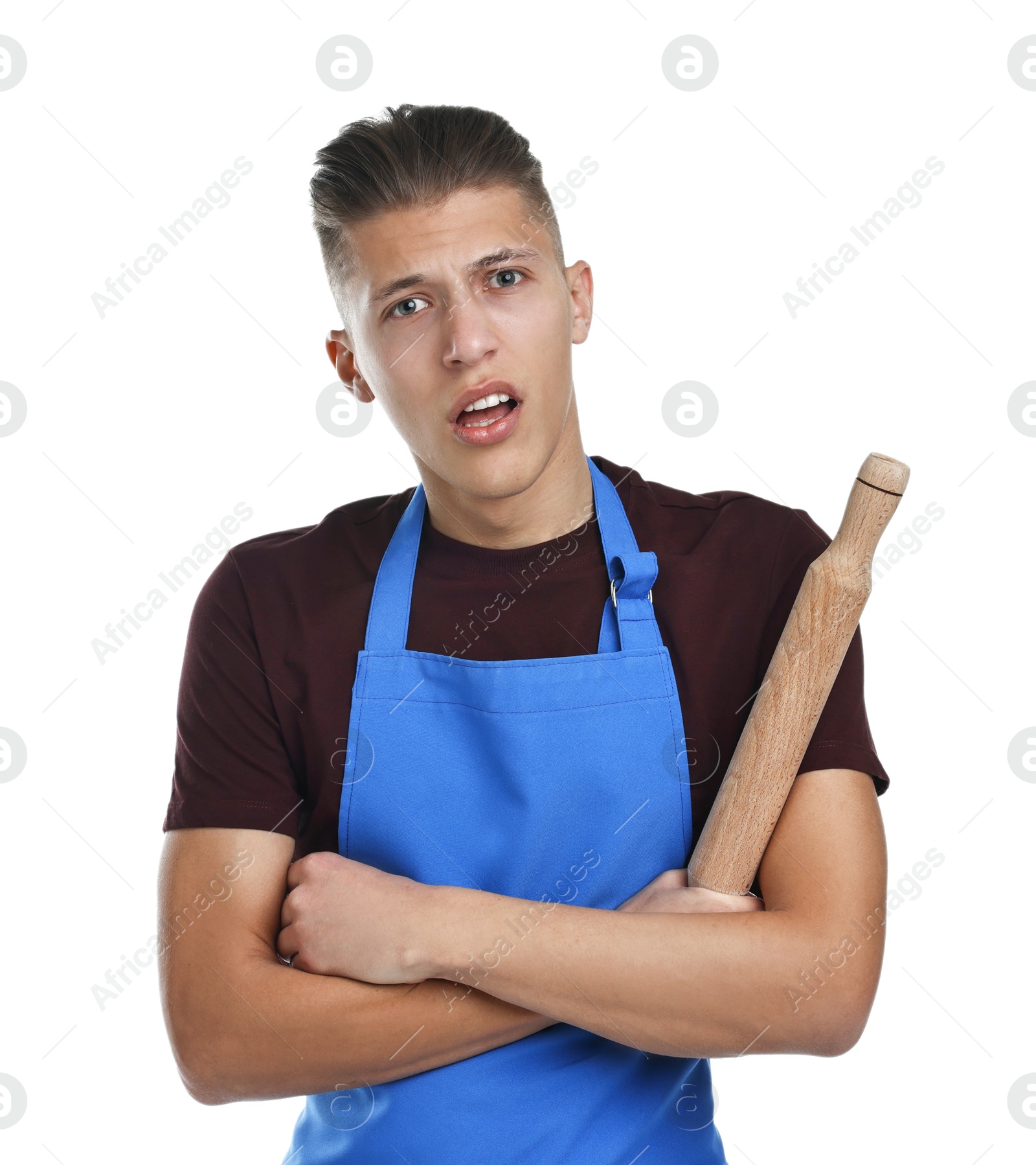 Photo of Confused man with rolling pin on white background