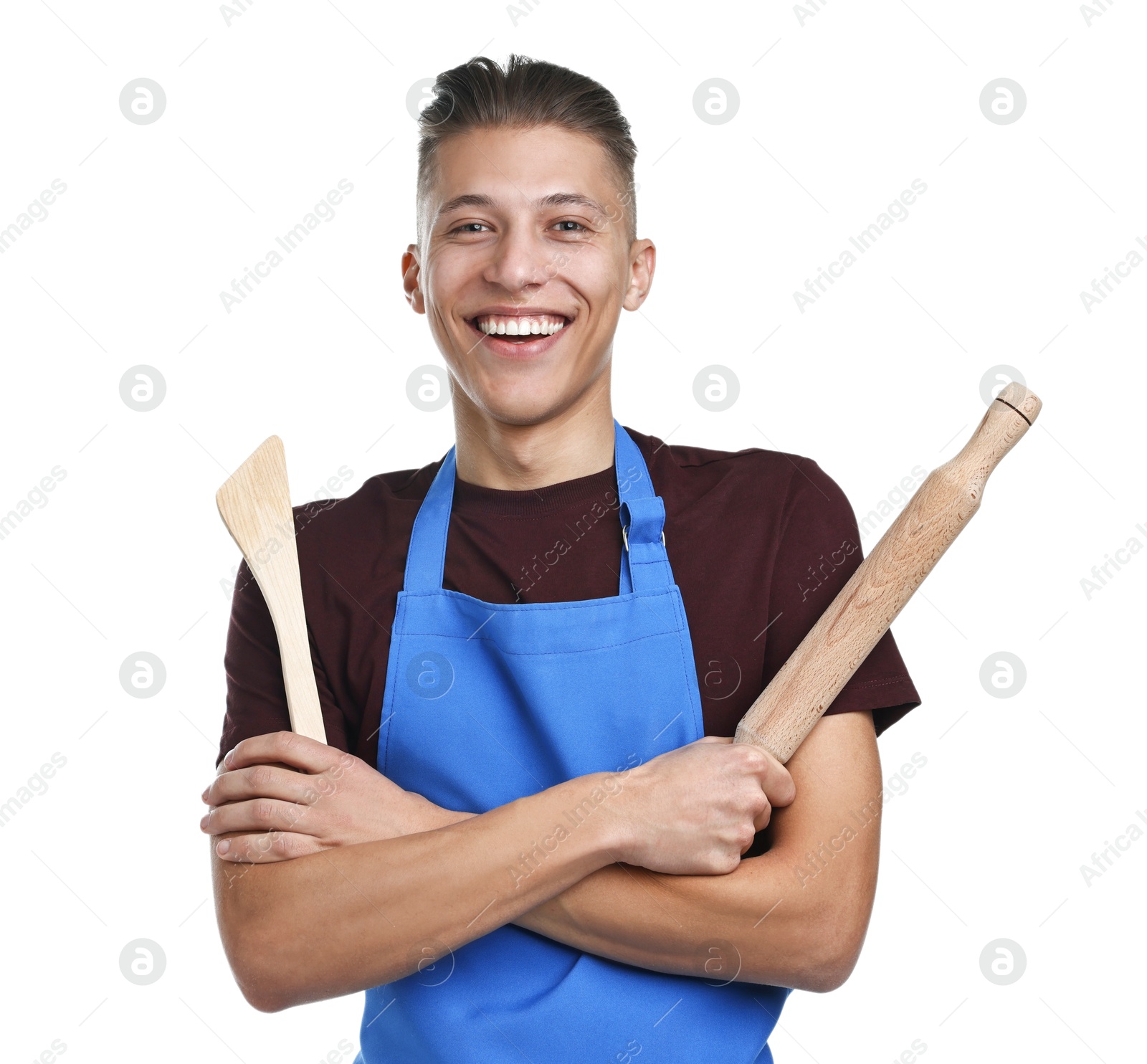 Photo of Happy man with rolling pin and turner on white background