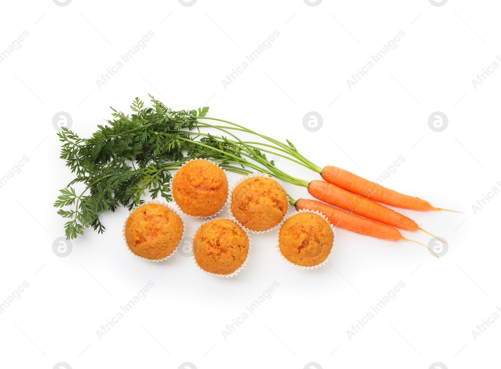 Photo of Tasty carrot muffins and fresh vegetables isolated on white, top view