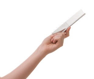 Photo of Woman with comb for pet grooming on white background, closeup