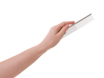 Photo of Woman with comb for pet grooming on white background, closeup