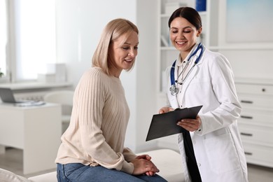 Photo of Woman having appointment with doctor in hospital