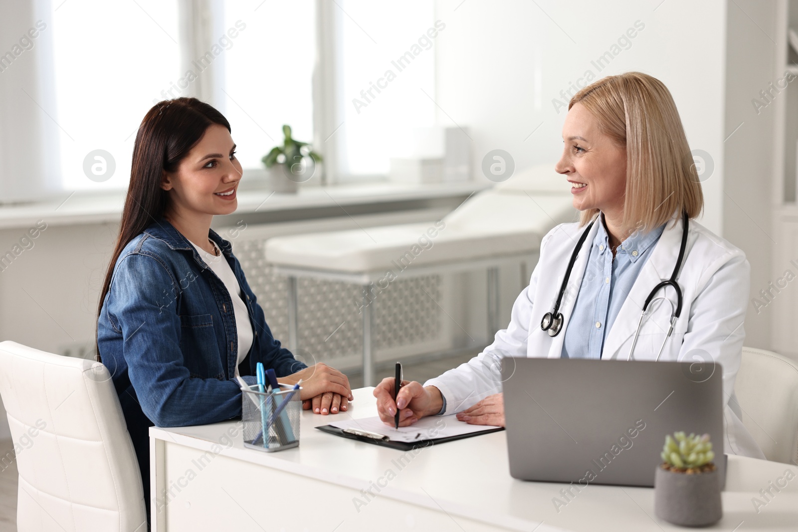 Photo of Woman having appointment with doctor in hospital