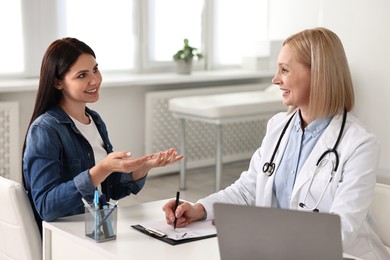 Photo of Woman having appointment with doctor in hospital