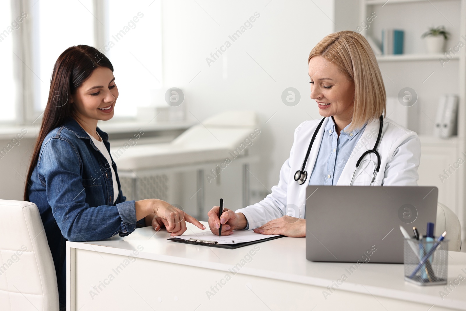 Photo of Woman having appointment with doctor in hospital