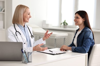 Photo of Woman having appointment with doctor in hospital