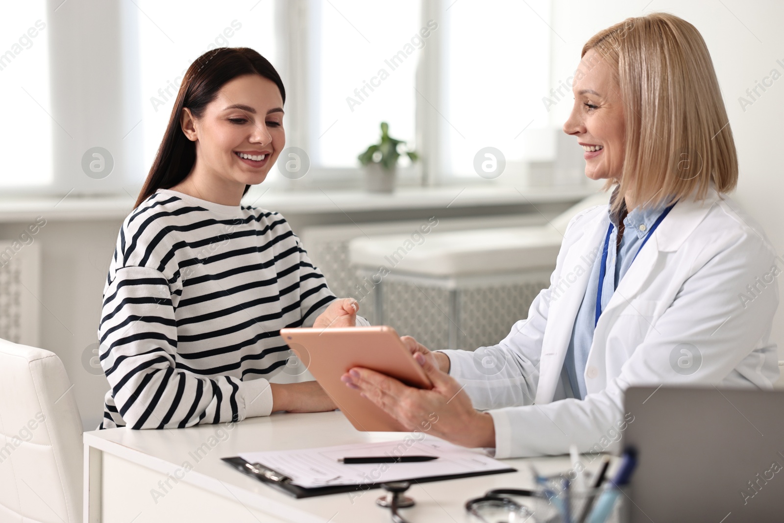 Photo of Woman having appointment with doctor in hospital