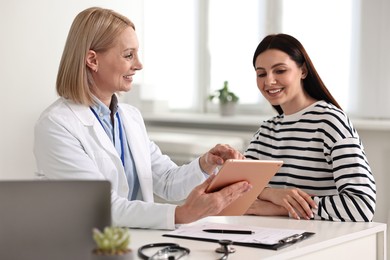 Photo of Woman having appointment with doctor in hospital