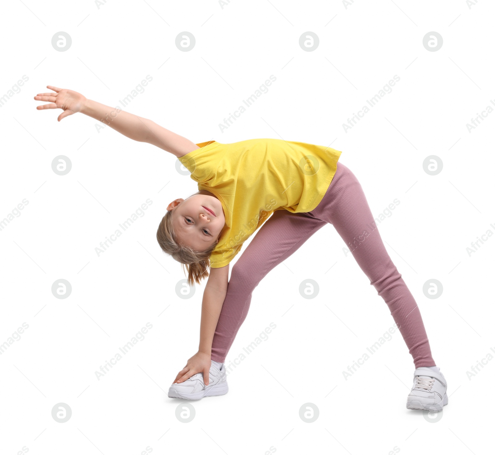 Photo of Cute little girl exercising on white background