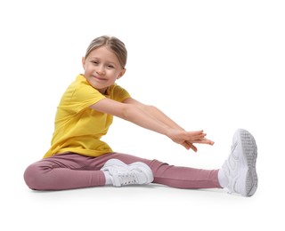 Photo of Cute little girl exercising on white background