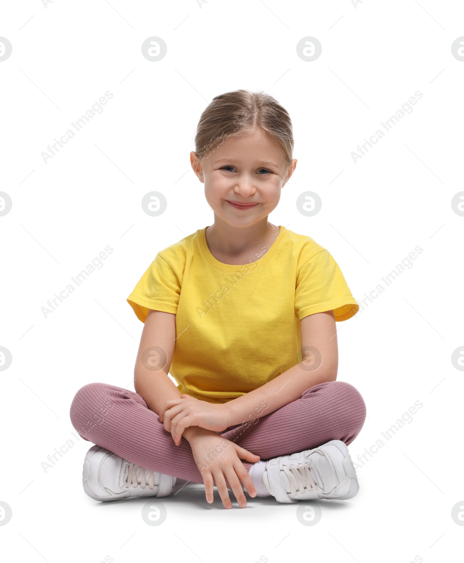 Photo of Cute little girl in sportswear on white background