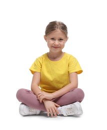 Photo of Cute little girl in sportswear on white background