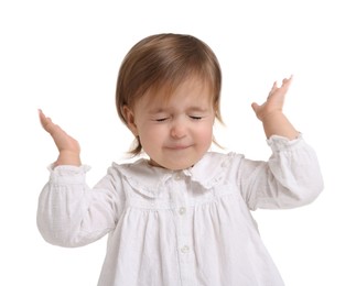 Photo of Cute little baby girl playing peekaboo on white background