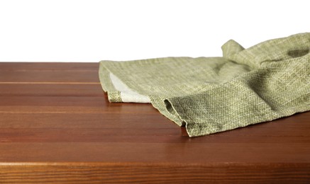 Photo of Green tablecloth on wooden table against white background, closeup