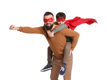 Photo of Father and his son wearing superhero costumes on white background