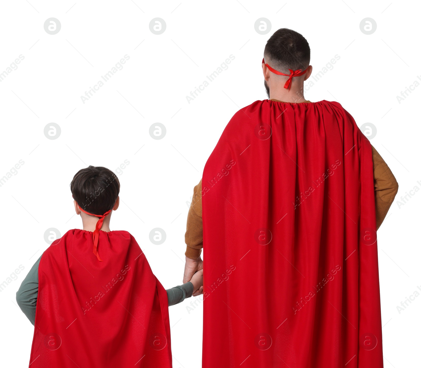 Photo of Father and his son wearing superhero costumes on white background, back view