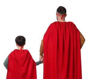 Photo of Father and his son wearing superhero costumes on white background, back view