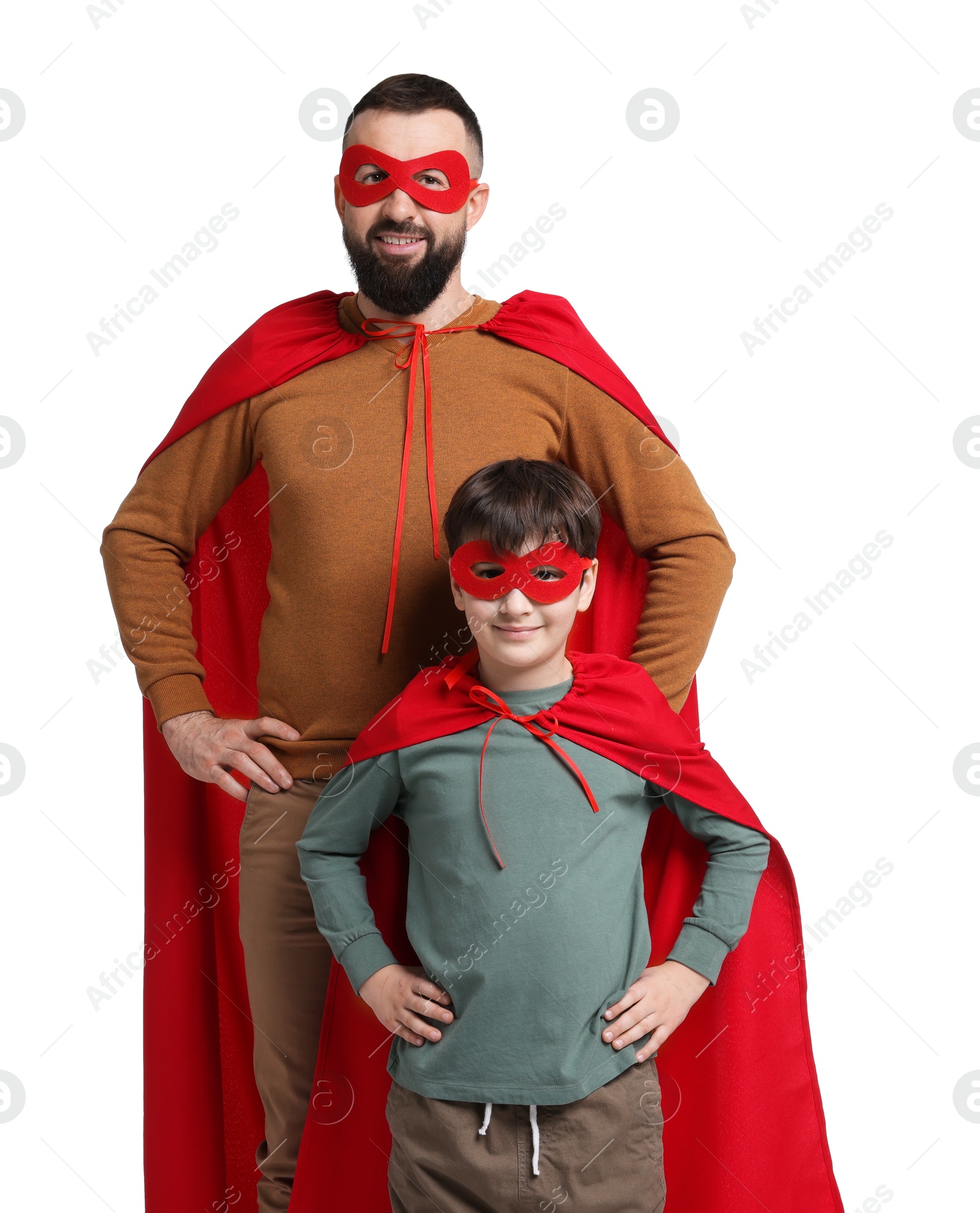 Photo of Father and his son wearing superhero costumes on white background