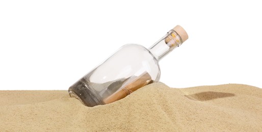 Photo of Rolled letter in corked glass bottle on sand against white background