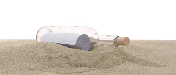 Photo of Rolled letter in corked glass bottle on sand against white background