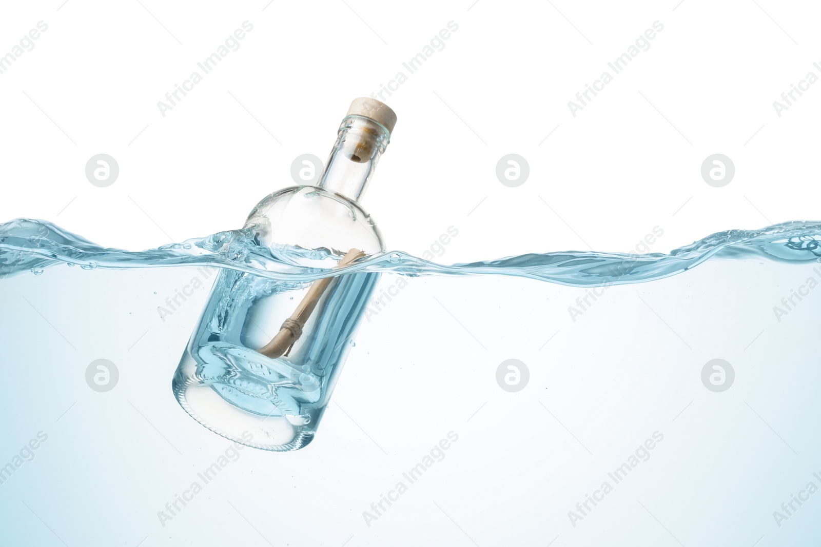 Photo of Corked glass bottle with rolled letter in water on white background