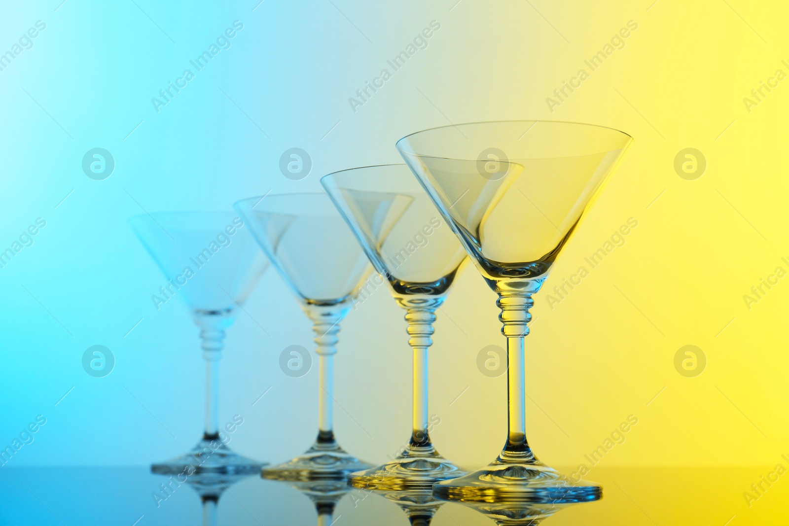 Photo of Empty glasses on table, color tone effect