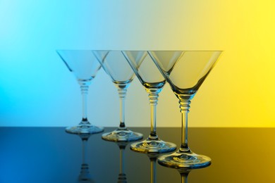 Photo of Empty glasses on table, color tone effect