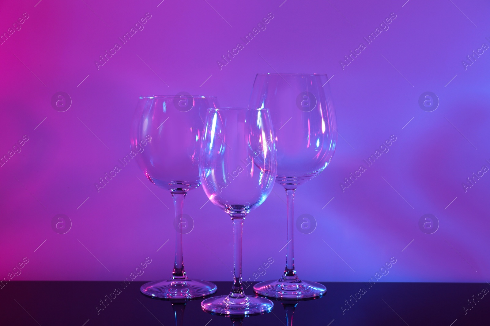 Photo of Empty glasses on table, color tone effect