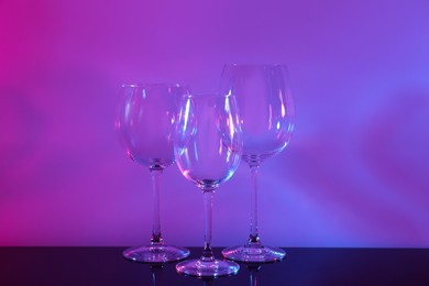 Photo of Empty glasses on table, color tone effect