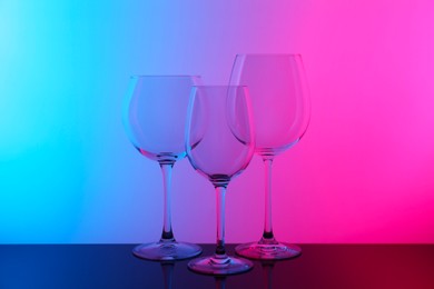 Photo of Empty glasses on table, color tone effect