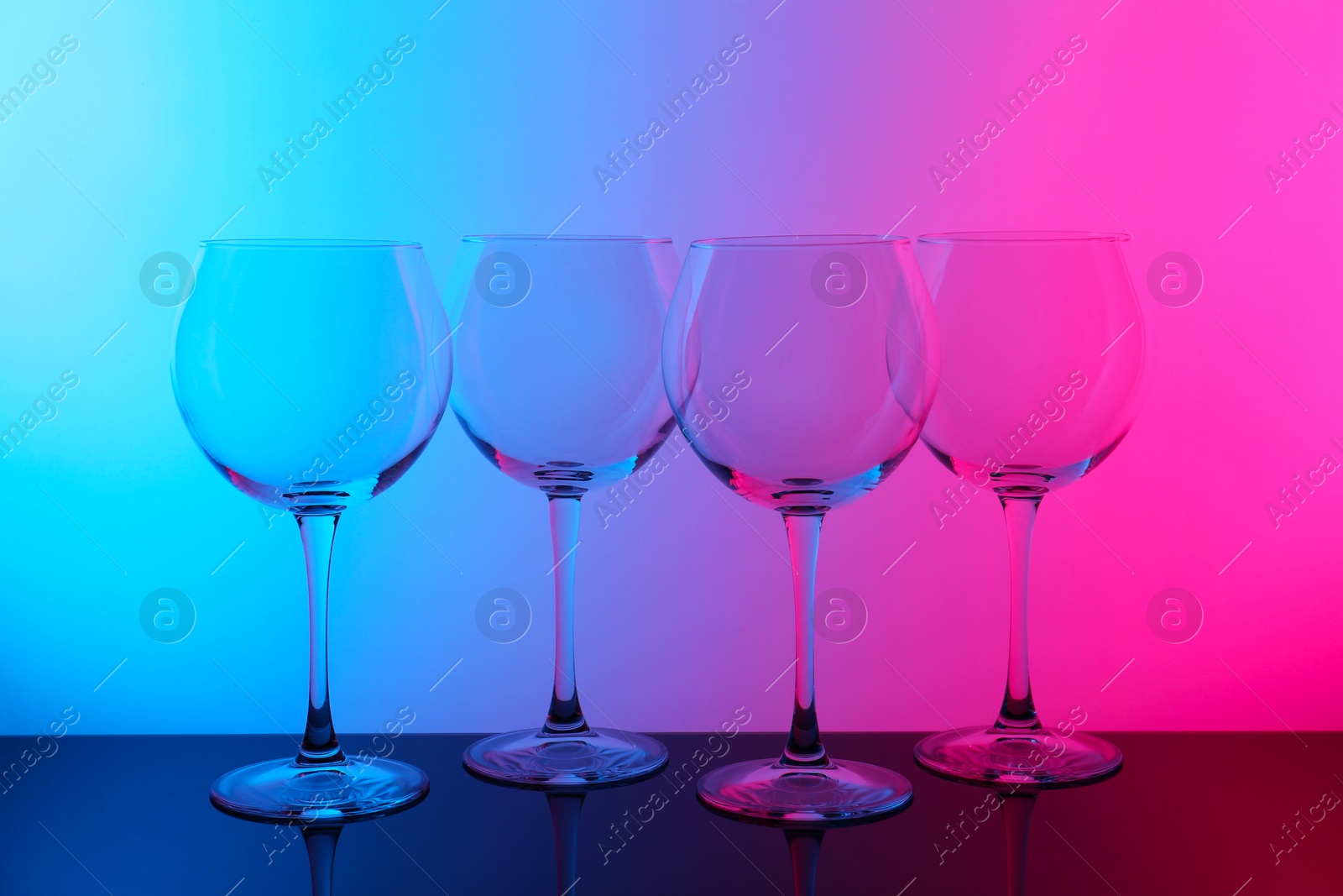 Photo of Empty glasses on table, color tone effect