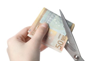 Photo of Woman cutting euro banknotes on white background, closeup