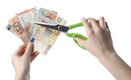 Photo of Woman cutting euro banknotes on white background, closeup